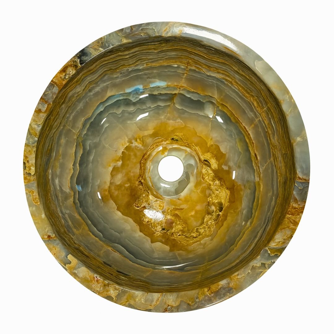 Lavabo redondo de ónix azul con diseño orgánico