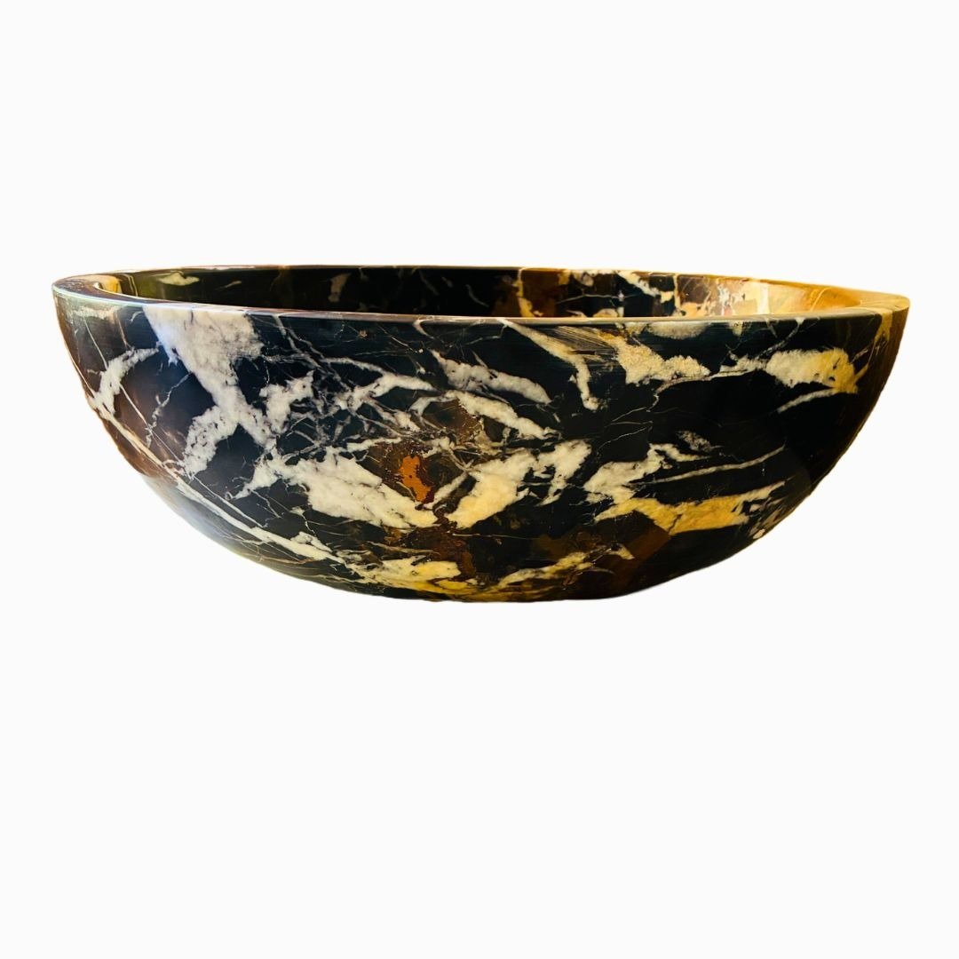 Lavabo redondo de mármol negro con acabado brillante y elegante diseño